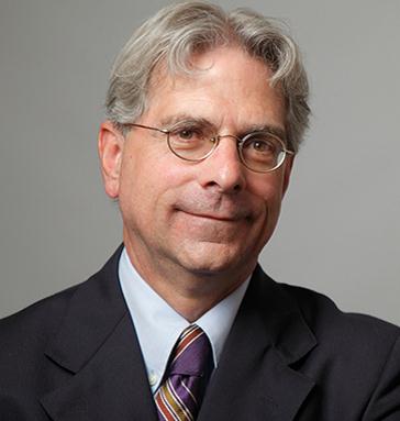 headshot of team member Paul J. Schulz
